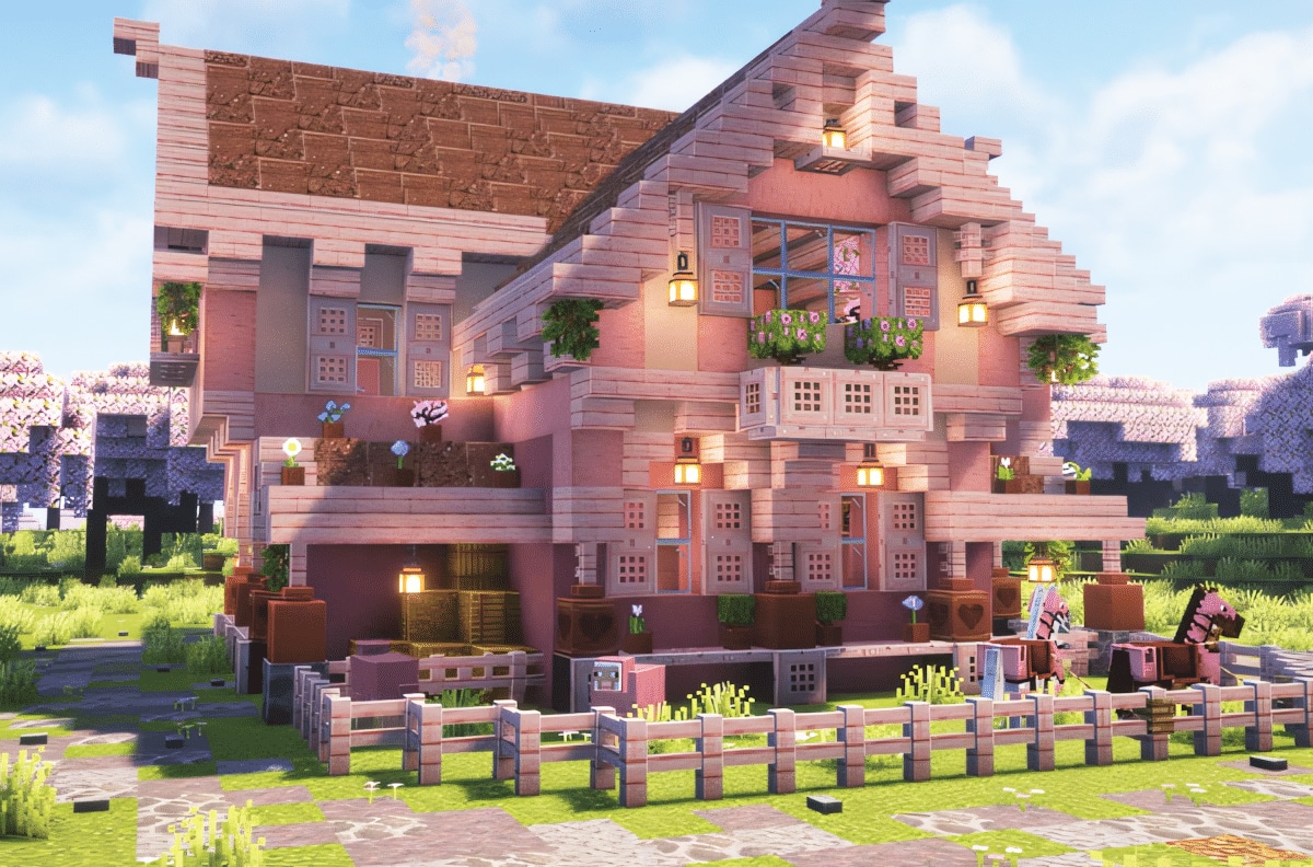 A Minecraft cherry blossom farm house with attached animal pens and crop fields