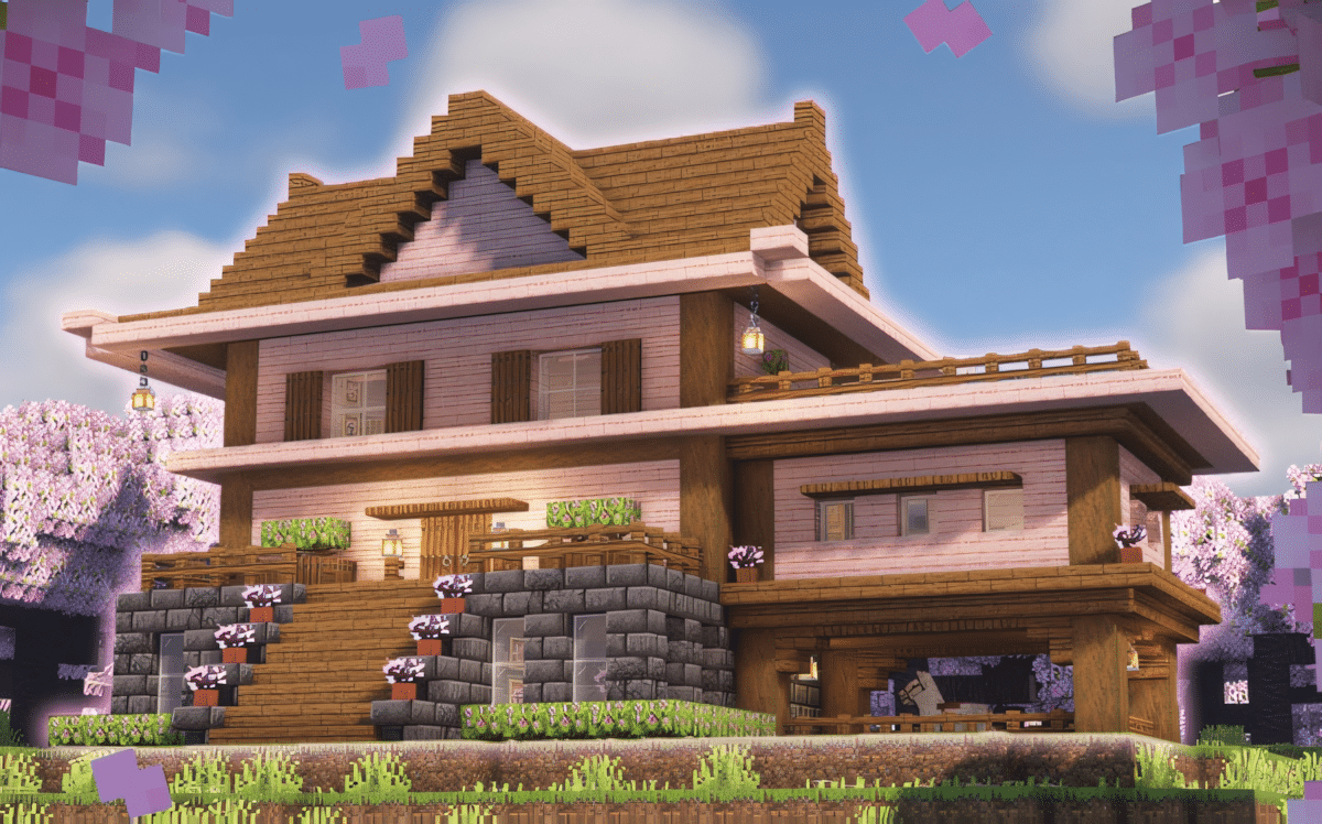 A large Minecraft cherry blossom mansion with multiple wings and pink cherry tree decoration