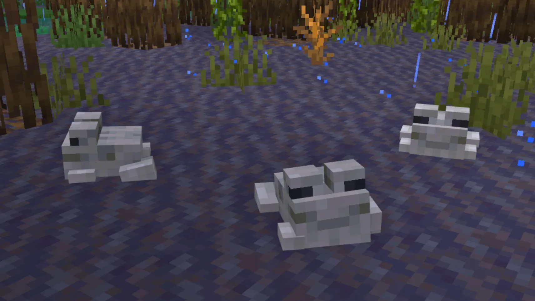 A Minecraft goat standing on a grassy mountainside during heavy rain with cloudy mountain peaks in the background